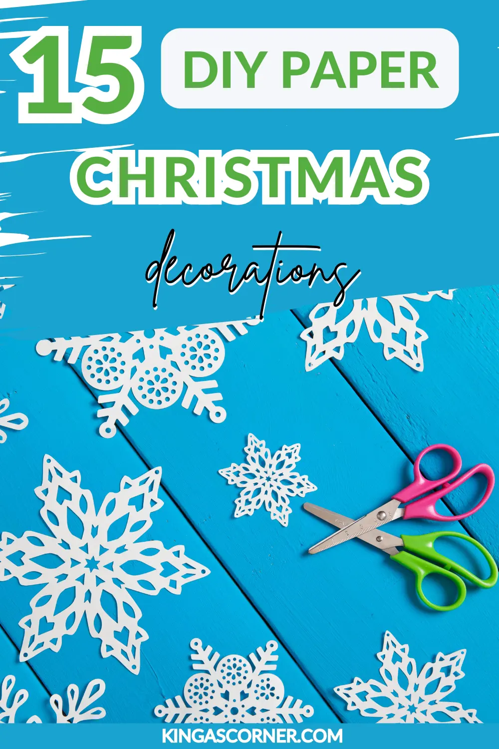 Colorful scissors and paper snowflakes on a blue wooden surface. Text reads: "15 DIY Paper Christmas Decorations.