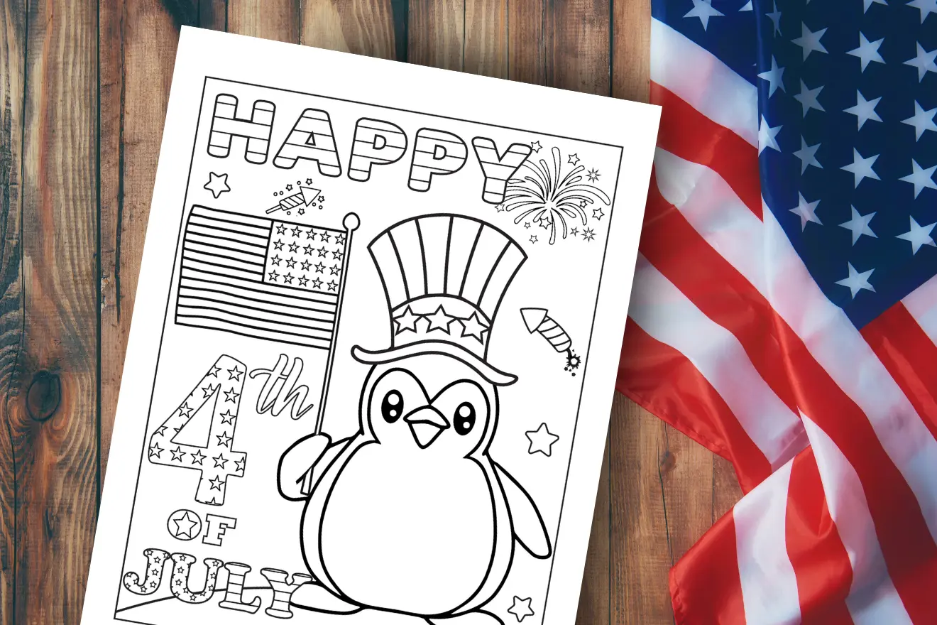 A coloring page featuring a penguin wearing a patriotic hat, holding an American flag, with "Happy 4th of July" text, next to a folded U.S. flag on a wooden surface.