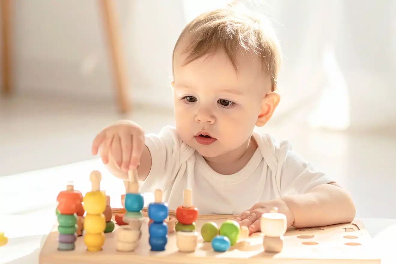 right infant developmental toys (ring stacker and cuddly block) ideal for 9-month-old