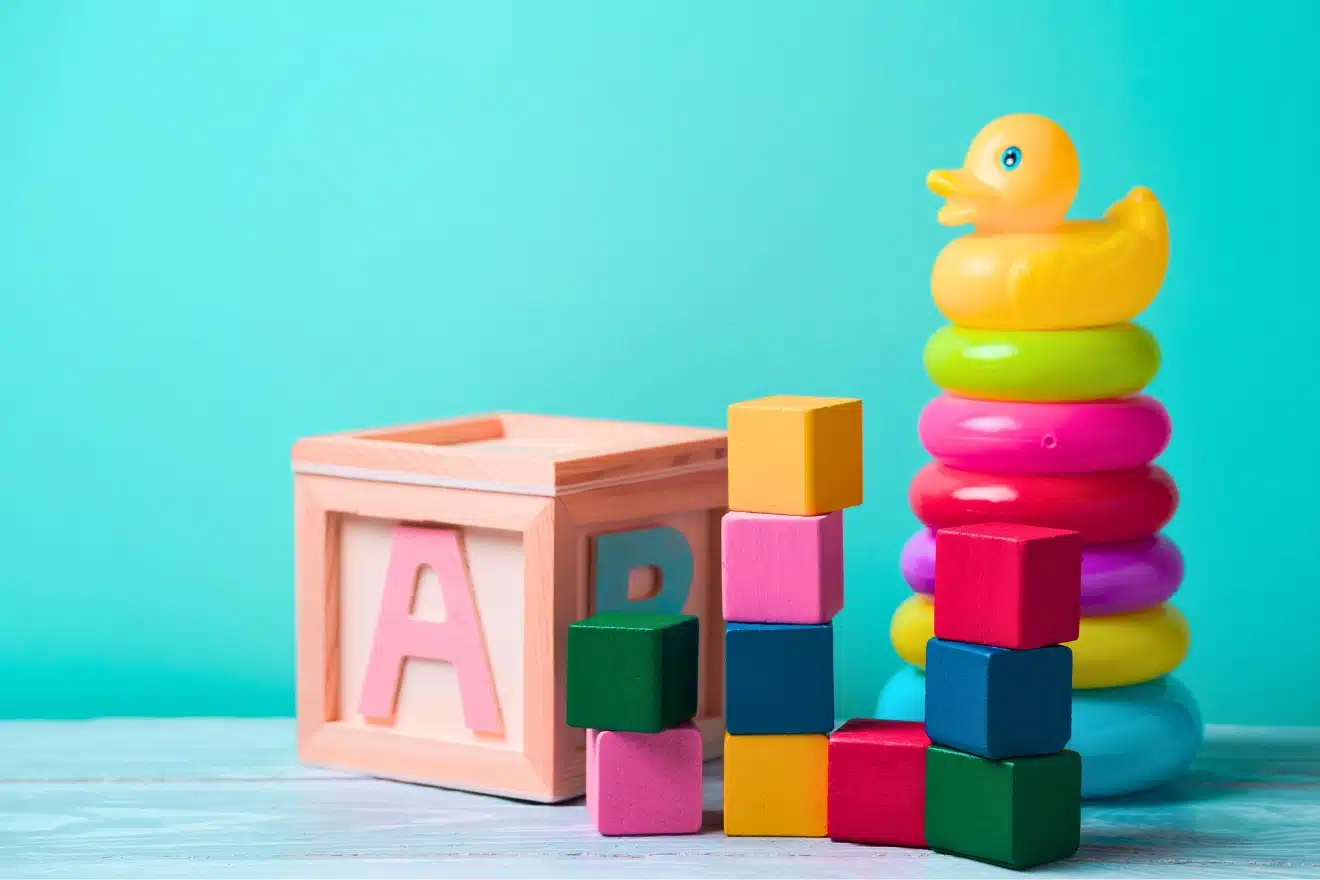 wooden block toy and rainbow ring stack with duck — ideal developmental toy for nine-month baby